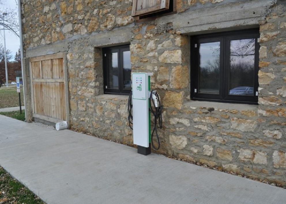 Charging station beside a stone wall